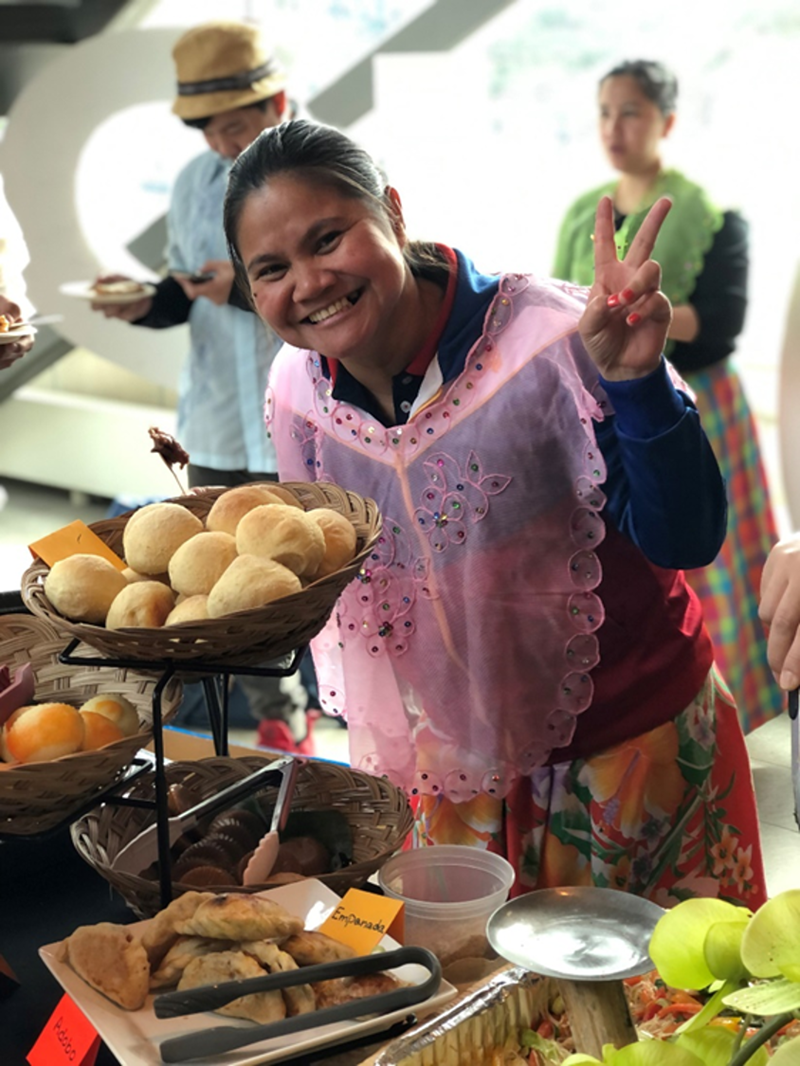 Crisalyn Minas serves traditional food from the Philippines as part of the GLOW event